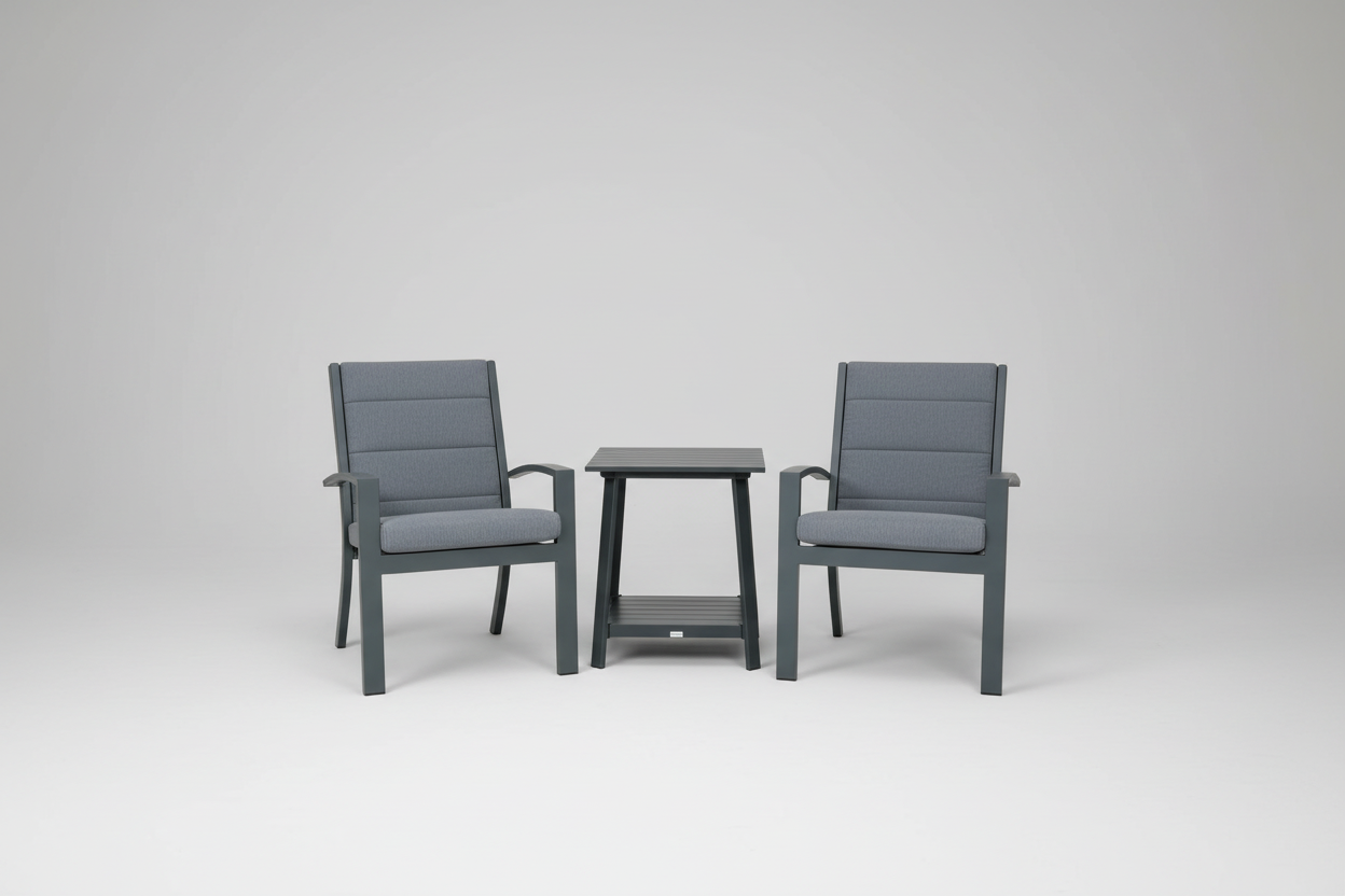 Two gray chairs with a matching table by a pool