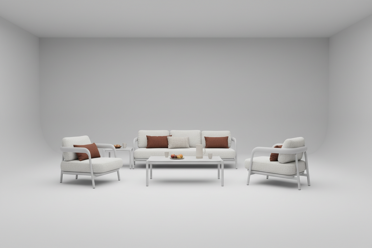 Diamond 4pc Outdoor patio set with sofa, chairs, and coffee table on a patio with pool and garden view.