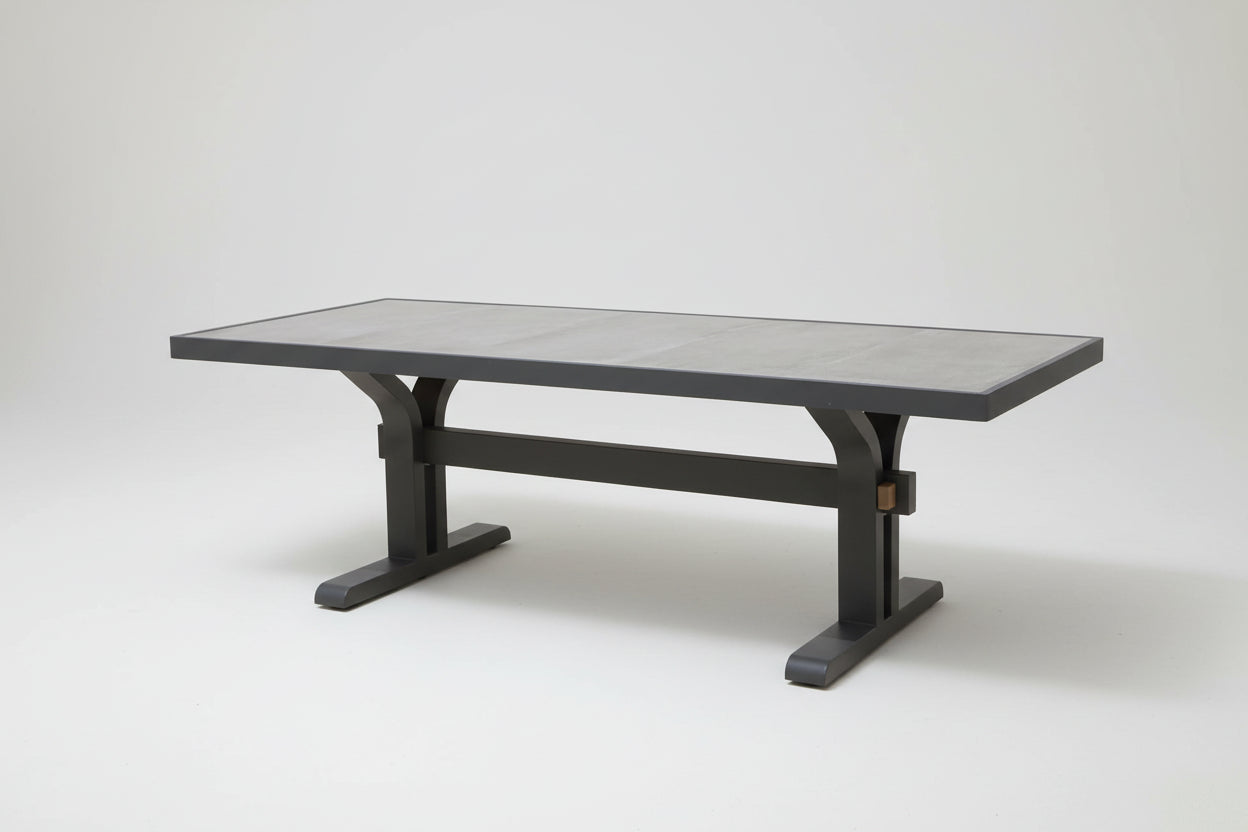 Rectangular table with a gray top and black metal frame on a white background